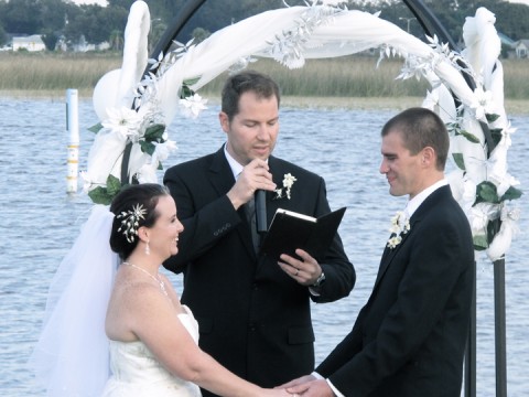 The Bride and Groom exchange their vows at The St Cloud Marina.
