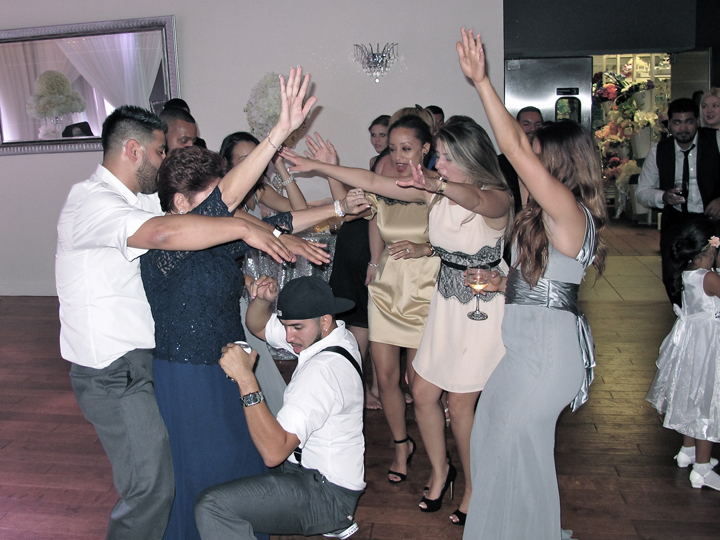 metrowest-crystal-ballroom-veranda-wedding-cake-guests-dancing