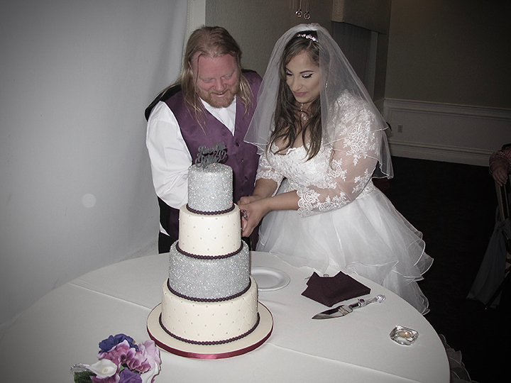 Cutting the wedding cake during the reception