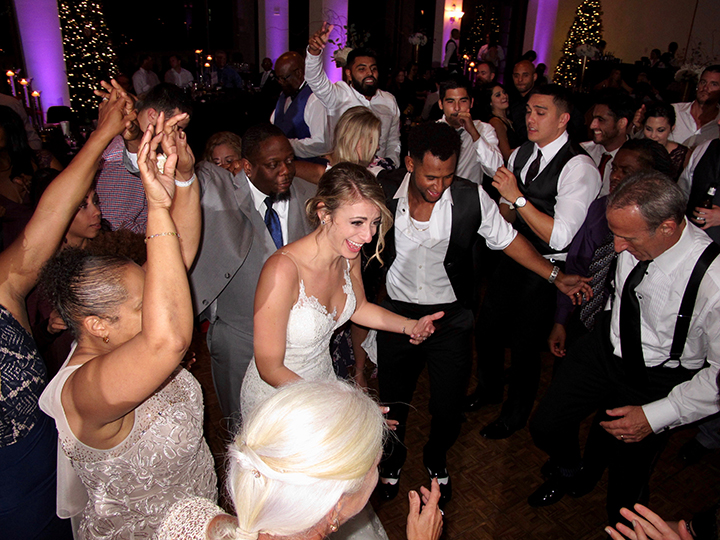 The Bride dances with her guests during her wedding reception