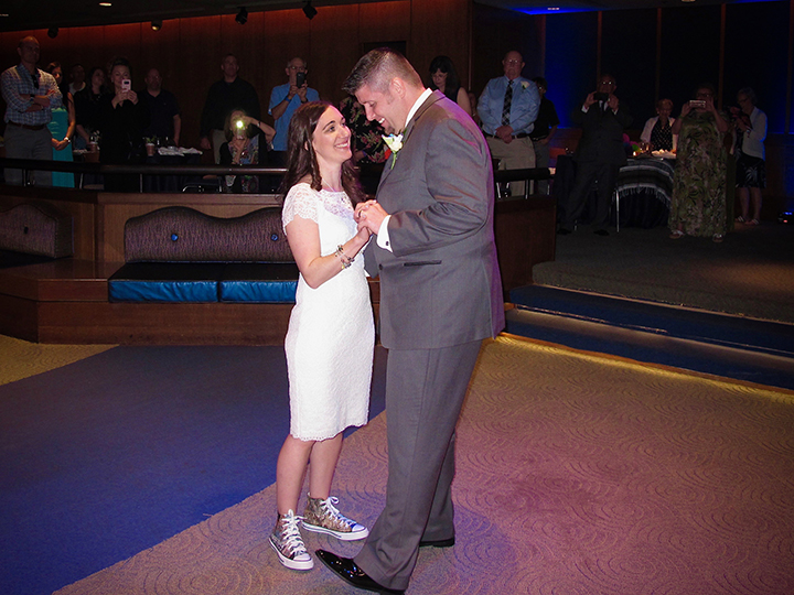 The wedding couple share their first dance at their Walt Disney World Reception