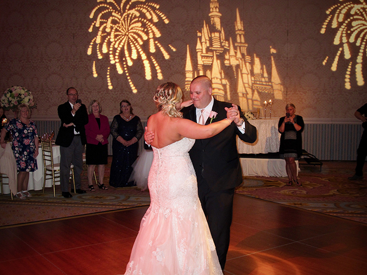 The Groom dances with his wife for the first time at this Walt Disney World Wedding.