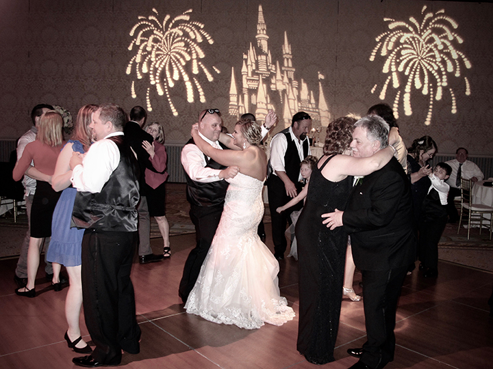 Wedding guests having a great time dancing with DJ Chuck Johnson at the Grand Floridian.