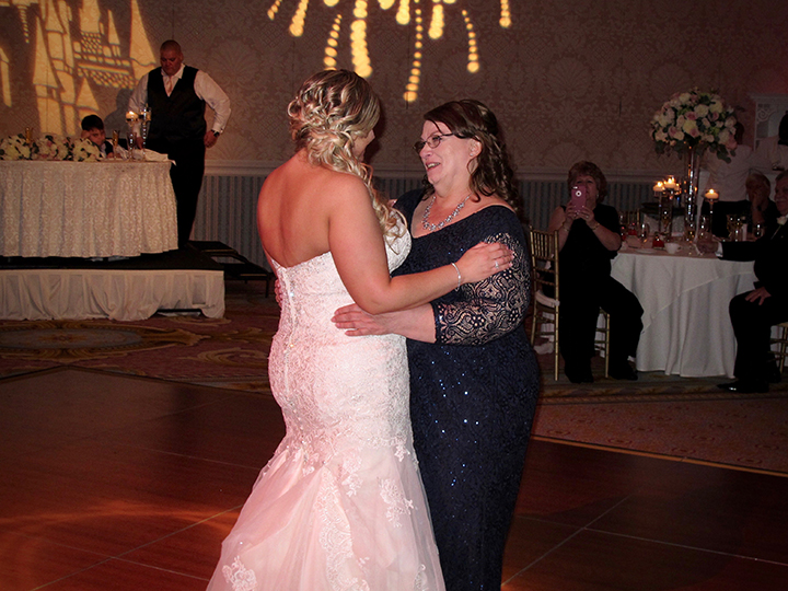 The Bride shares a dance with her mom at the Grand Floridian.