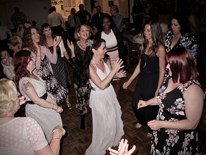 The bride is dancing with family and friends to music from Orlando Wedding DJs Chuck Johnson