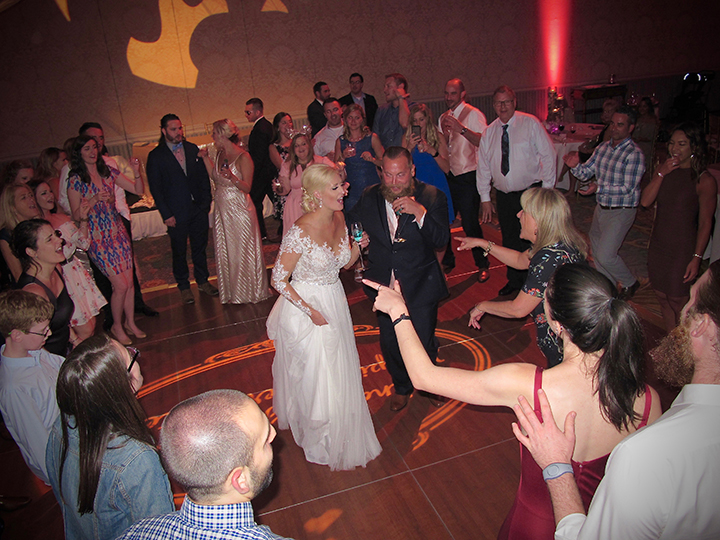 The Bride and Groom are having fun with wedding guests to music for Orlando DJs Chuck Johnson