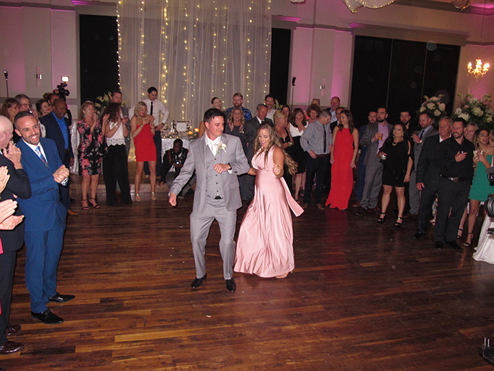 The groom dances with friends and family at the wedding reception hosted by DJ Chuck Johnson.