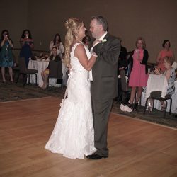The Bride and Groom share their first dance together on the dance floor.