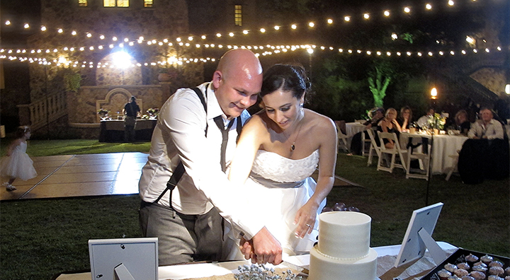 Cutting the wedding cake on the Grande Lawn at Bella Collina- under the stars.