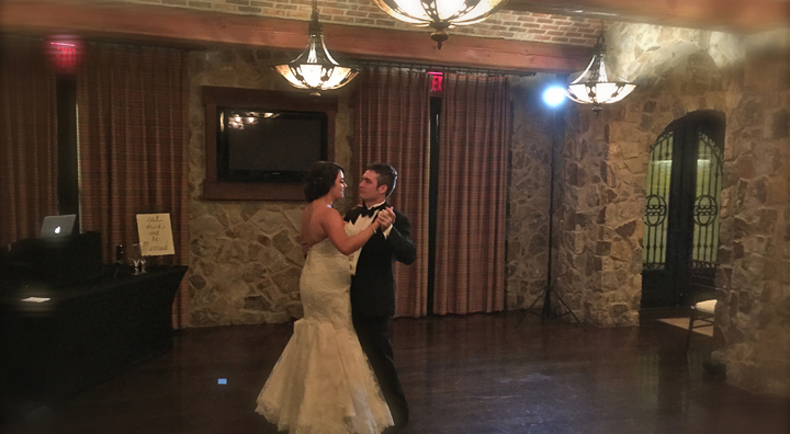 A bride and groom share a private dance at their wedding reception at Bella Collina.