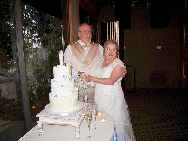 Cutting the wedding cake at the reception at Marina Del Rey.