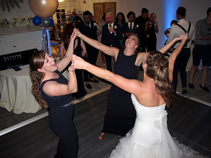 The bride and her bridesmaids dance at the reception at the Hyatt Grand Cypress Lakeside Casita.