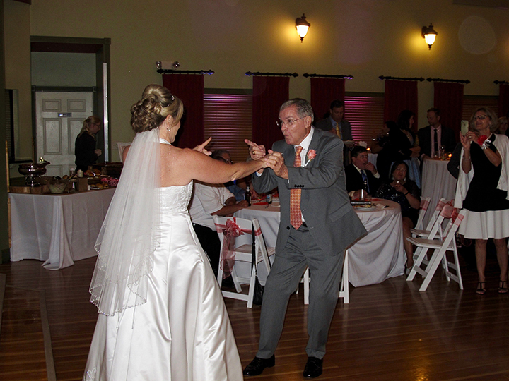 The bride and her dad share the Father-Daughter Dance with Orlando Wedding DJ Chuck Johnson.