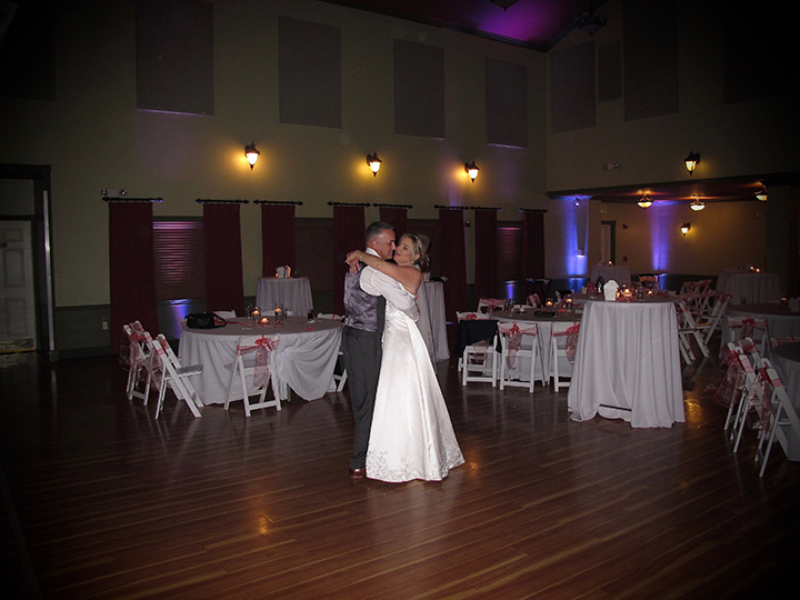 The Wedding couple share a private moment at the end of their wedding reception on the dance floor.