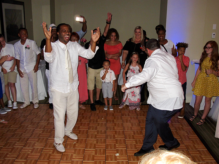 Groom dancing with his friends and family at the Hilton Cocoa Beach Oceanfront with Orlando Wedding DJ Chuck Johnson