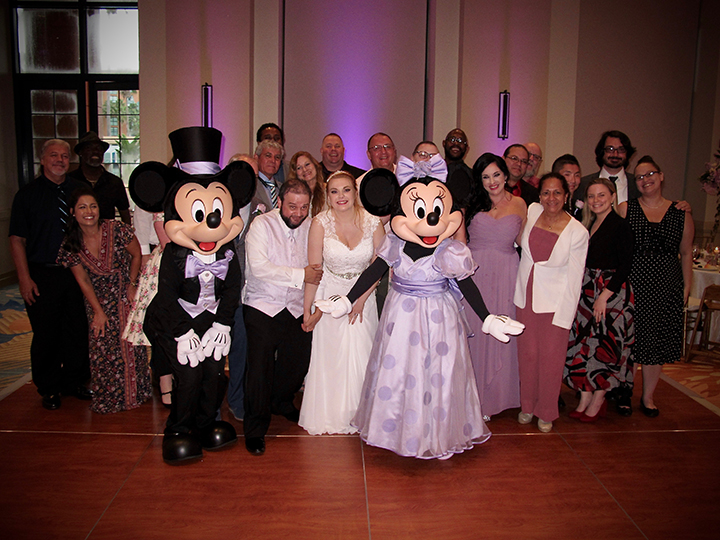A perfect review: Mickey and Minnie crash a wedding reception at the Walt Disney World Swan.