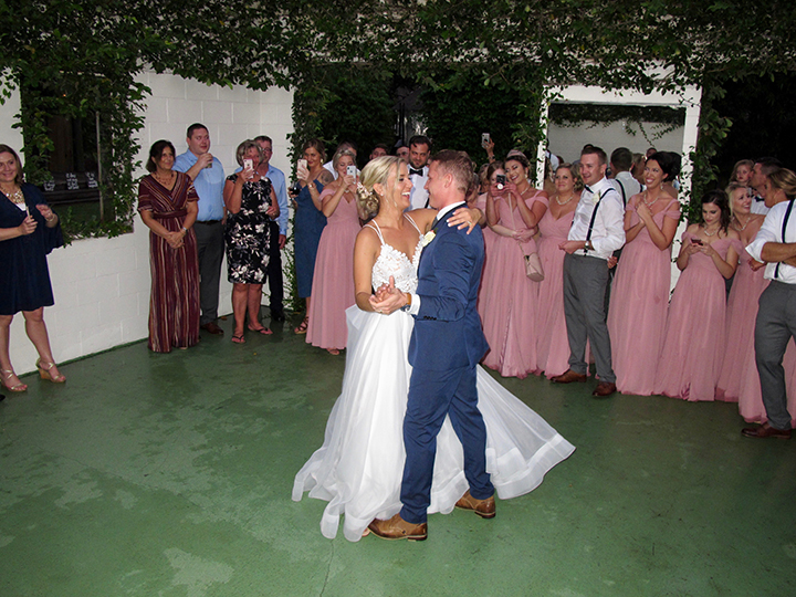 The bride and groom share their first dance at their wedding at the Acre Orlando