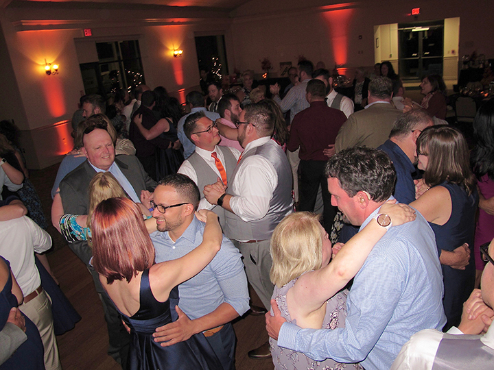 Same-sex wedding couple Wes and Derek celebrate with their guests and Orlando DJ Chuck Johnson