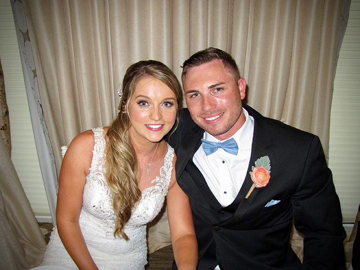 The bride and groom celebrating their wedding at the Lake Nona Golf & Country Club.