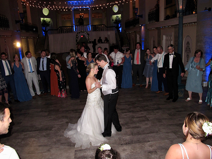 The Bride and Groom celebrate with Wedding DJ Chuck Johnson at the their reception at the Lightner Museum in St Augustine, FL.