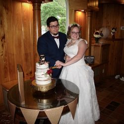 The wedding couple cut their cake at their reception at the Estate on the Halifax.