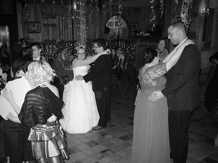 Wedding guests join the happy couple on the dance floor at the Estate on the Halifax.
