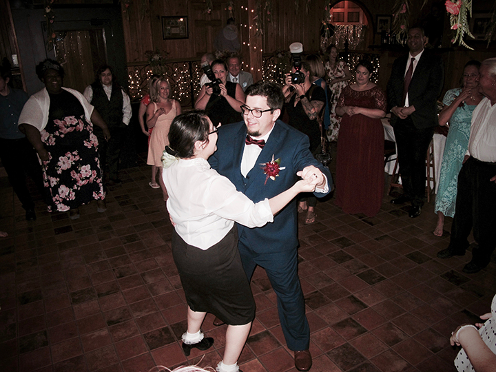 The groom has some fun on the dance floor at his wedding at the Estate on the Halifax.