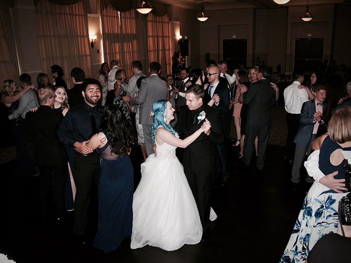The bride and groom dance with their guests with Orlando Wedding DJ Chuck Johnson.