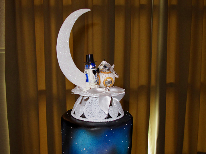 The wedding cake topper features Star Wars droids at the Lake Mary Events Center.