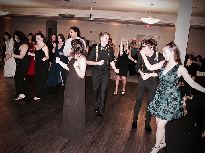 Guests having fun on the dance floor at this Cocoa Civic Center Wedding.