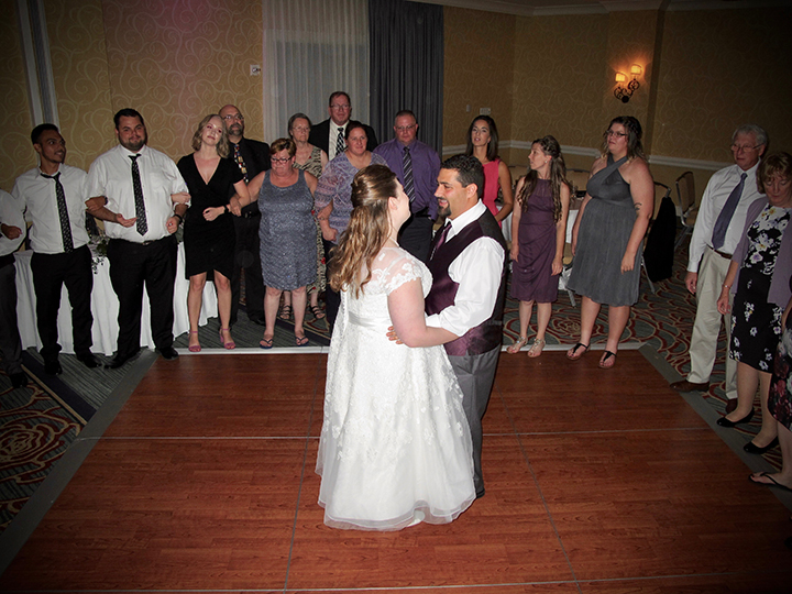 Orlando DJ Chuck Johnson has fun with the couple and family and friends at their wedding.