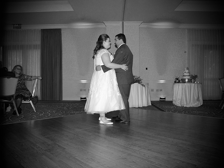 The couple share the dance floor at an Omni Championsgate wedding.