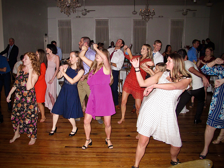 Guests are having fun on the dance floor at this Venue 1902 Wedding.