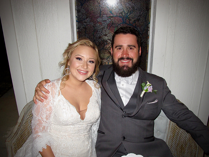 The bride and groom are featured here with Vero Beach Wedding DJ Chuck Johnson.