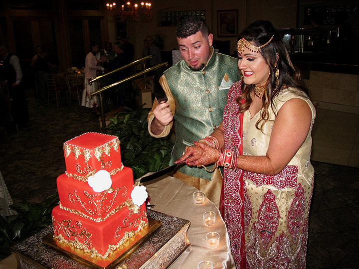 A Hindi Wedding with Orlando Wedding DJ Chuck Johnson during the cake cutting.